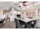 Bright dining room with a wooden table set next to a kitchen and many windows with natural light at 7750 E Broadway Rd # 54, Mesa, AZ 85208