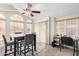 Bright dining room with a wooden table set with many windows and natural light at 7750 E Broadway Rd # 54, Mesa, AZ 85208