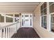 Inviting entryway featuring a white door with decorative glass, wood-look floors, and neutral paint at 7750 E Broadway Rd # 54, Mesa, AZ 85208