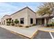 Commercial building featuring stucco siding, trimmed windows and professional landscaping at 7750 E Broadway Rd # 54, Mesa, AZ 85208