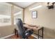 This office boasts a modern wooden desk set next to a window for a bright, inspiring workspace at 7750 E Broadway Rd # 54, Mesa, AZ 85208