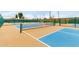 Active lifestyle awaits with this vibrant pickleball court featuring blue and tan playing surfaces at 7750 E Broadway Rd # 54, Mesa, AZ 85208