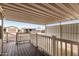 Covered front porch featuring white railings and a dark wood-look deck, perfect for relaxing at 7750 E Broadway Rd # 54, Mesa, AZ 85208