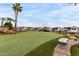 Scenic putting green within a vibrant community, boasting tropical landscaping and a relaxed atmosphere at 7750 E Broadway Rd # 54, Mesa, AZ 85208