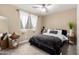 Cozy bedroom featuring a neutral palette, soft carpet, and stylish decor at 7840 W Bonitos Dr, Phoenix, AZ 85035