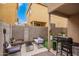 Cozy patio area with comfortable seating, a grill, and an area of artificial turf at 7840 W Bonitos Dr, Phoenix, AZ 85035