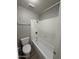 Full bathroom featuring a shower-tub combo and essential fixtures at 7955 W Mackenzie Dr, Phoenix, AZ 85033