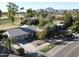 Aerial view of home showcasing golf course views, private pool, and lush landscaping at 8005 N Via De Lago --, Scottsdale, AZ 85258