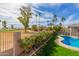 Inviting backyard with pool, lush greenery, and golf course views, perfect for outdoor enjoyment at 8005 N Via De Lago --, Scottsdale, AZ 85258