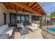 Inviting backyard patio with a fire pit, outdoor seating, and a view of the pool at 8005 N Via De Lago --, Scottsdale, AZ 85258