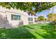 Lush green backyard featuring a well-maintained lawn and a sparkling pool at 8005 N Via De Lago --, Scottsdale, AZ 85258