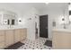 Bright bathroom featuring double sinks, neutral cabinets, and patterned tile flooring at 8005 N Via De Lago --, Scottsdale, AZ 85258