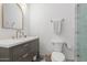 Bathroom featuring a stylish vanity with a white countertop and bronze fixtures, with a toilet and glass-door shower at 8005 N Via De Lago --, Scottsdale, AZ 85258