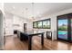 Well-lit kitchen with a center island, wine cooler, marble counters, and a view of the outdoor pool at 8005 N Via De Lago --, Scottsdale, AZ 85258