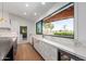Bright kitchen featuring marble countertops, a large window with scenic views, and modern appliances at 8005 N Via De Lago --, Scottsdale, AZ 85258