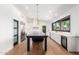 Contemporary kitchen with a central island, marble countertops, stainless steel appliances, and wooden floors at 8005 N Via De Lago --, Scottsdale, AZ 85258