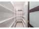 Walk-in pantry with white shelving and herringbone tile flooring at 8005 N Via De Lago --, Scottsdale, AZ 85258