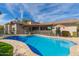 Swimming pool with well-manicured lawn and desert landscaping surrounding property at 8005 N Via De Lago --, Scottsdale, AZ 85258