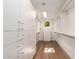 Spacious walk-in closet with custom built-in storage and hardwood floors at 8005 N Via De Lago --, Scottsdale, AZ 85258
