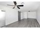 Inviting bedroom with wood floors, updated fixtures, and a stylish barn door closet at 8335 E Montecito Ave, Scottsdale, AZ 85251