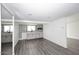 Modern kitchenette with gray cabinets, updated appliances, and mosaic tile backsplash at 8335 E Montecito Ave, Scottsdale, AZ 85251