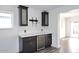 Elegant living area with custom cabinets, quartz countertop, and stainless steel beverage fridge at 8335 E Montecito Ave, Scottsdale, AZ 85251