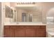 Bathroom view with large vanity, dual sinks, and large mirror at 835 E Stirrup Ln, San Tan Valley, AZ 85143