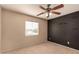 Bedroom featuring accent wall and standard ceiling fan at 835 E Stirrup Ln, San Tan Valley, AZ 85143