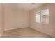 Neutral bedroom offering natural light through a window, and tile flooring at 835 E Stirrup Ln, San Tan Valley, AZ 85143