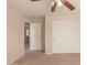 Bedroom featuring standard ceiling fan and closet at 835 E Stirrup Ln, San Tan Valley, AZ 85143