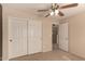 Bedroom featuring standard ceiling fan and closet at 835 E Stirrup Ln, San Tan Valley, AZ 85143