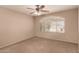 Carpeted bedroom with neutral walls and ceiling fan at 835 E Stirrup Ln, San Tan Valley, AZ 85143