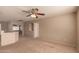 This bonus room features neutral carpeting and a ceiling fan at 835 E Stirrup Ln, San Tan Valley, AZ 85143