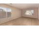 A living room featuring tile flooring, light walls, and natural light at 835 E Stirrup Ln, San Tan Valley, AZ 85143