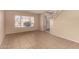 A living room featuring tile flooring, light walls, and a staircase at 835 E Stirrup Ln, San Tan Valley, AZ 85143