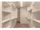 Walk-in closet with shelving and plenty of storage space at 835 E Stirrup Ln, San Tan Valley, AZ 85143