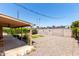 Expansive backyard featuring gravel ground cover, defined by a sturdy block wall, and covered patio at 8538 E Vista Dr, Scottsdale, AZ 85250