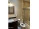 Full bathroom with framed mirror and shower behind glass doors at 8538 E Vista Dr, Scottsdale, AZ 85250