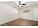 Bedroom features modern ceiling fan, wood-look flooring, bright and airy with plantation shutters at 8538 E Vista Dr, Scottsdale, AZ 85250