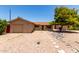 Charming single-story home with a well-maintained front yard, stone accents, and attached garage at 8538 E Vista Dr, Scottsdale, AZ 85250