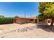 Street view of single-story home features low maintenance landscaping and an attached garage at 8538 E Vista Dr, Scottsdale, AZ 85250