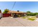 Charming home exterior with gravel ground cover, a covered patio, and manicured yard at 8538 E Vista Dr, Scottsdale, AZ 85250