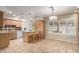 Bright eat-in kitchen with tile floor, center island, lots of cabinet space, and bright, natural lighting at 8538 E Vista Dr, Scottsdale, AZ 85250