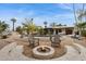 Enjoy the desert evenings around this backyard firepit and lounge area at 8709 E Mackenzie Dr, Scottsdale, AZ 85251