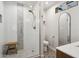 Modern bathroom with white subway tile shower and glass door with rain shower head at 8709 E Mackenzie Dr, Scottsdale, AZ 85251