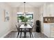 Cozy dining area with stylish decor and natural light at 8709 E Mackenzie Dr, Scottsdale, AZ 85251