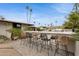 Entertain in style with this outdoor kitchen and bar area overlooking the pool at 8709 E Mackenzie Dr, Scottsdale, AZ 85251