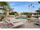 Lounge by this beautiful pool and enjoy the desert landscaping and towering palms at 8709 E Mackenzie Dr, Scottsdale, AZ 85251