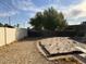 Large backyard featuring a weathered wooden deck and a tall privacy wall, perfect for outdoor activities and relaxation at 9033 N 15Th Dr, Phoenix, AZ 85021