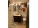 Bathroom with vanity sink, toilet, and framed mirror at 9033 N 15Th Dr, Phoenix, AZ 85021